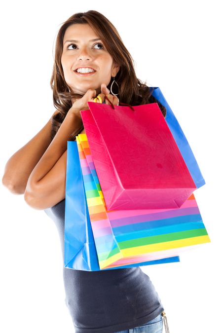 Beautiful shopping woman smiling isolated over a white background