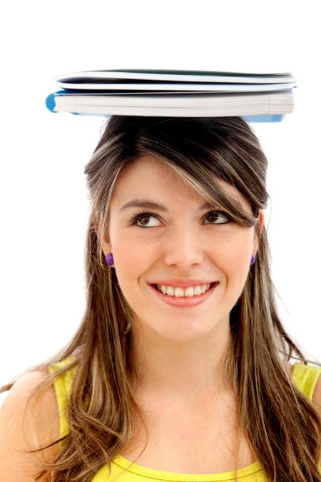 Pensive female student with notebook on her head - isolated