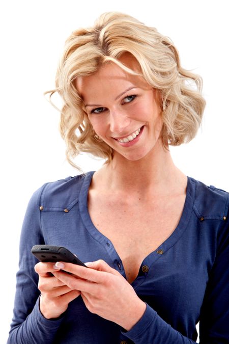 Beautiful woman texting on her cell phone isolated over a white background