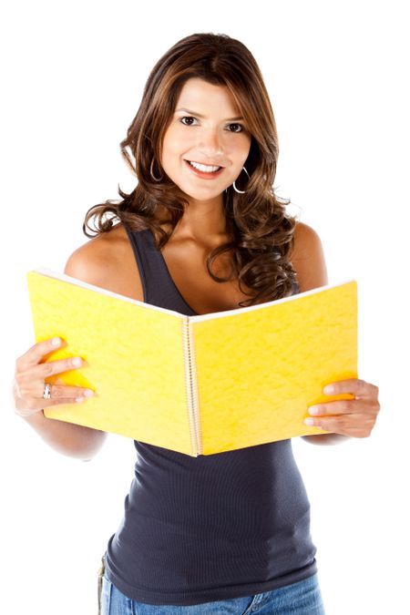 Beautiful female student holding a notebook - isolated over a white background