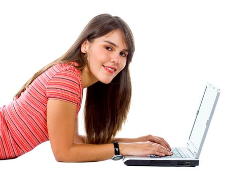 Girl lying on the floor with a laptop isolated over a white background