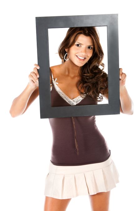 Beautiful woman holding a frame isolated over a white background
