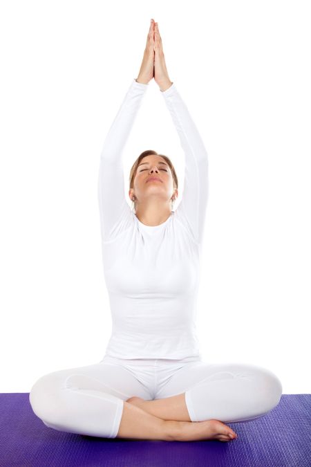 beautiful woman doing yoga exercises isolated over a white background