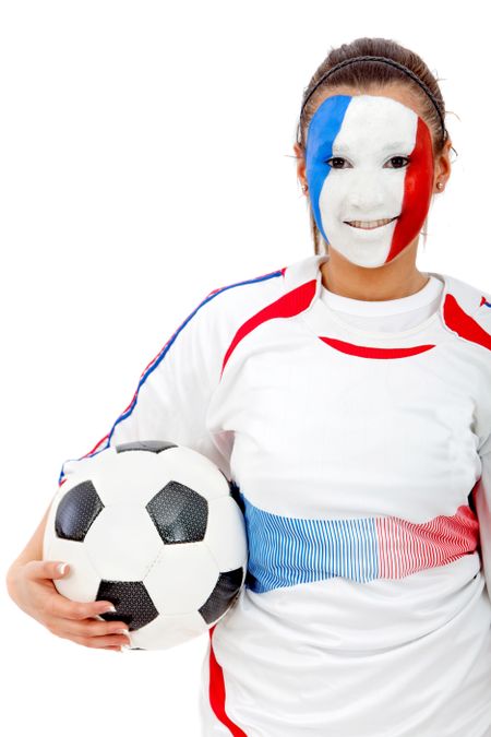 Portrait of a woman holding a soccer ball with the french flag painted on her face isolated over white