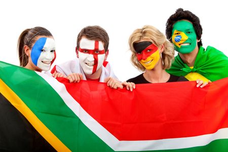 Group of football fans holding a southafrican flag with their faces painted isolated over white