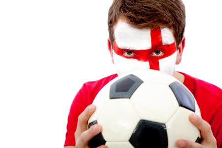 Portrait of an english football fan with his face painted and holding the ball - isolated
