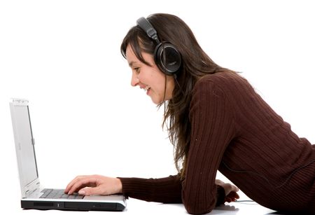 girl listening to music on a laptop mp3 music over a white background