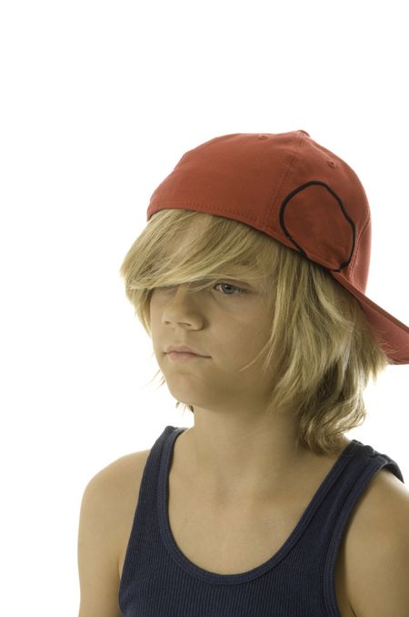Caucasian boy of ten wearing red baseball cap and blue tanktop, right eye hidden by long blond hair