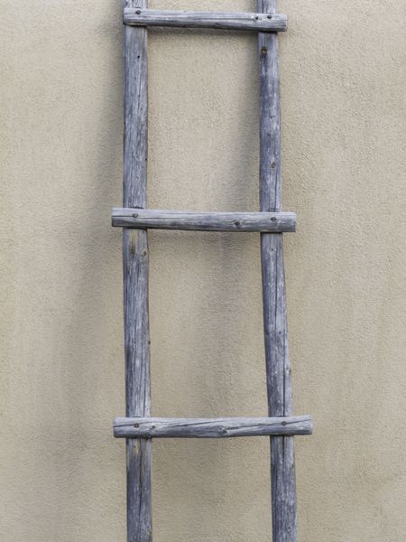 Simplicity in Santa Fe: wooden ladder by adobe wall