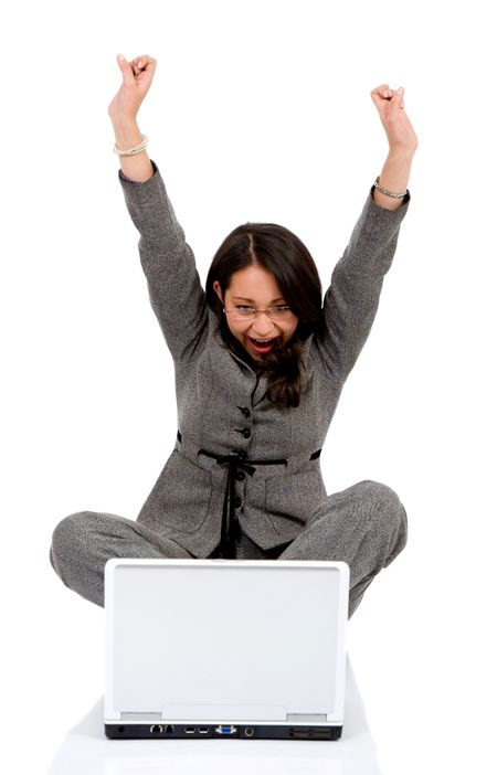 business woman happy with her success while working on a laptop - isolated over a white background