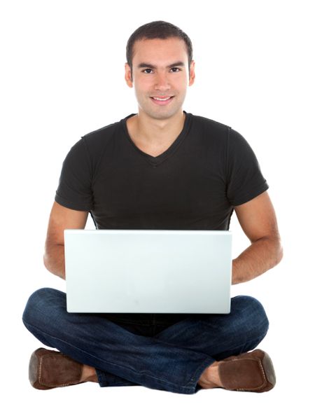 Man sitting on the floor with a laptop - isolated over a white background
