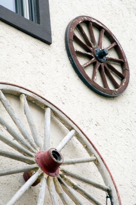 Wagon wheels above entrance to store