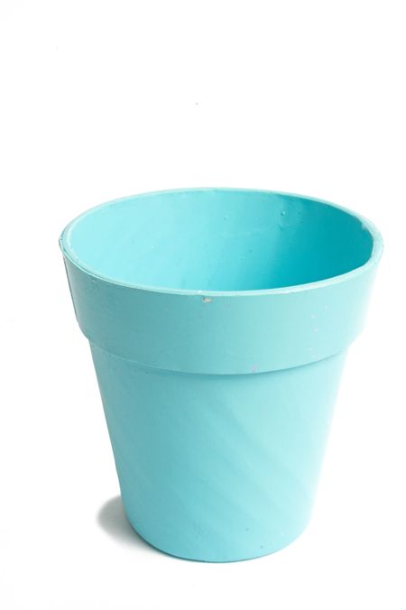 cyan plant pot over a white background