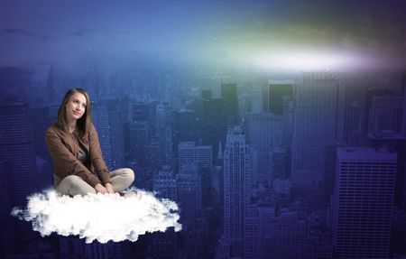 Caucasian woman sitting on a white fluffy cloud above the big city wondering
