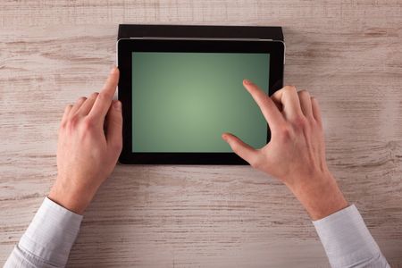 Caucasian business hands holding and working on plain tablet