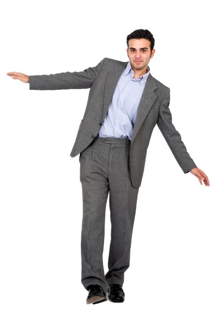 business man balancing isolated over a white background