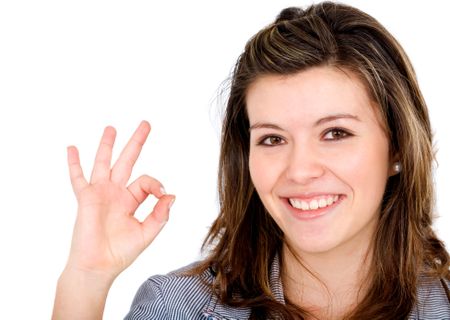 business woman smiling doing the okay sign over a white background