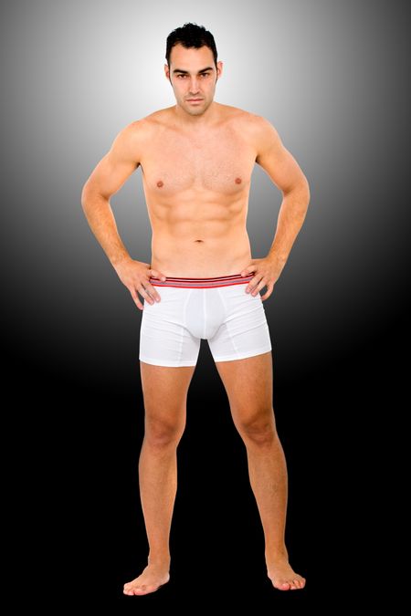 fashion underwear model portrait standing over a dark background