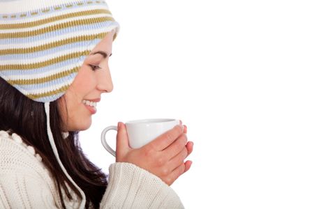 Winter woman drinking a cup of coffee ? isolated