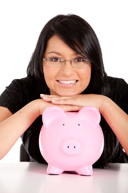 business woman looking at her savings in a piggy bank - isolated