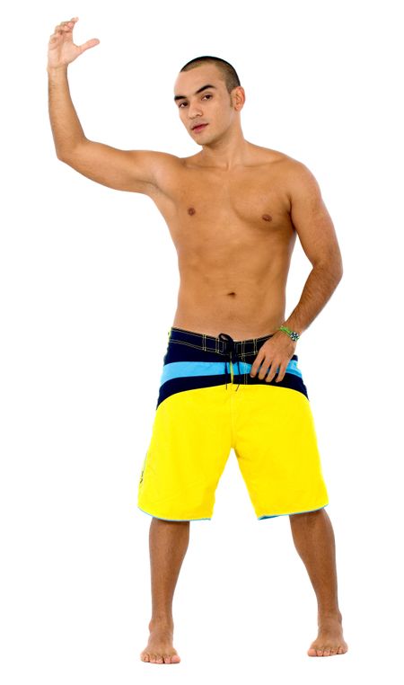 muscular man holding something in beach clothes isolated over a white background