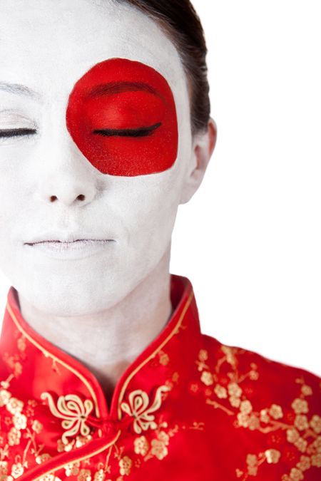 Japanese woman in Asian outfit with the flag painted on her face