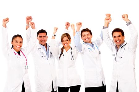 Happy group of doctors with arms up - isolated over white