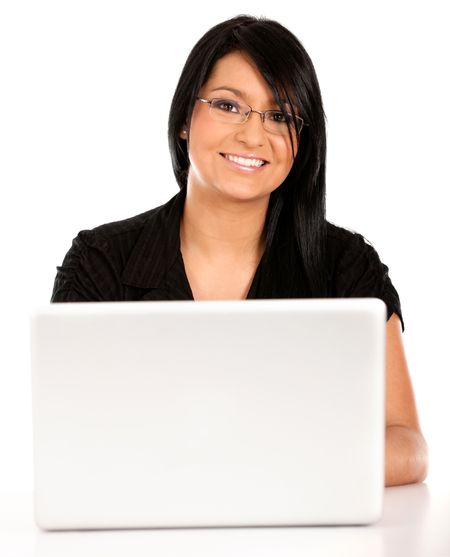 Business woman working on a laptop computer ? isolated