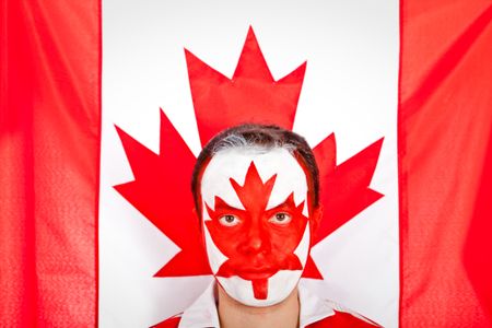 Patriotic Canadian man with the flag painted on his face