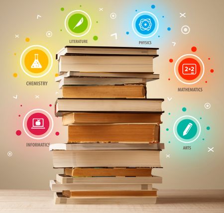 Books on top with colorful symbols on vintage old background