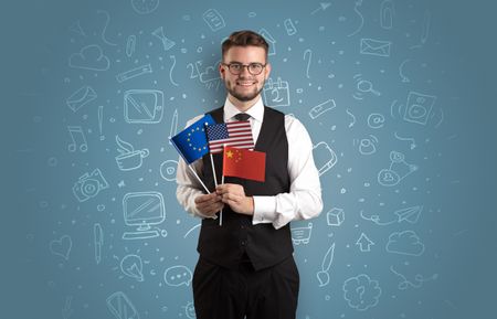 Businessman with office symbol concept and little flag on his hand
