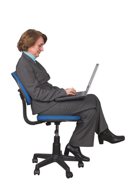 business woman browsing on a laptop on a chair over white