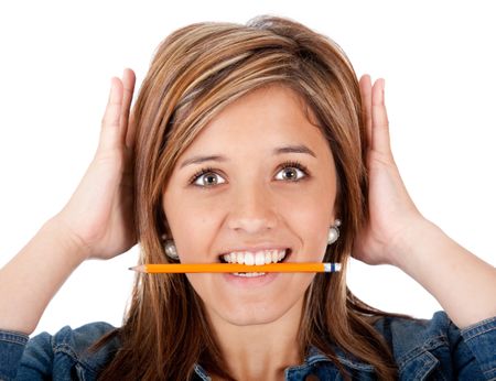 Confused female student with a pencil in her mouth ? isolated