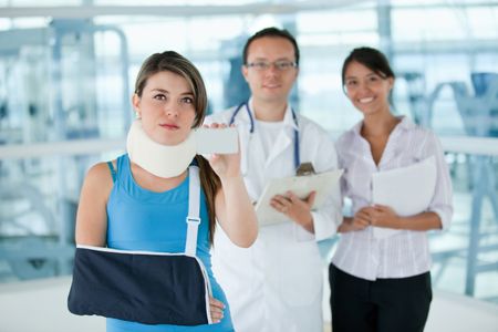 Injured insured woman displaying an insurance card