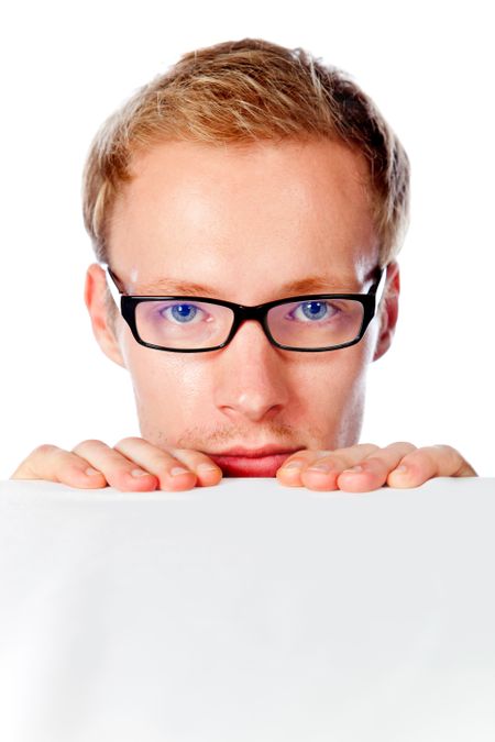Man peeking over a white table wearing glasses - isolated