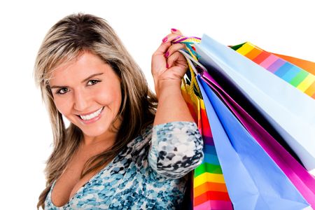 Girl shopping and carrying bags - isolated over a white background