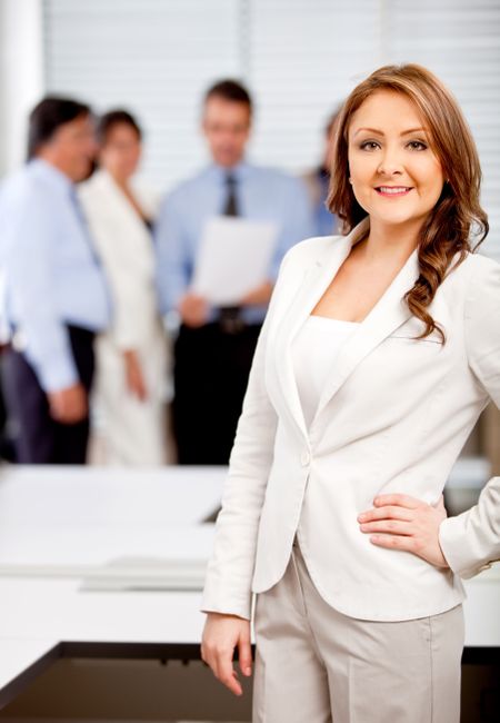 Successful woman leading a business team at the office