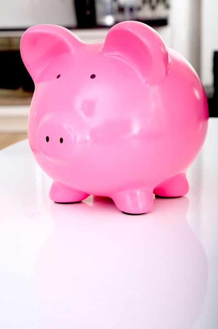 pink piggy bank at home on a table top