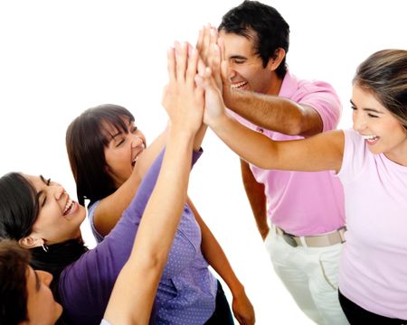 Happy group of young friends giving a high-five isolated over a white background
