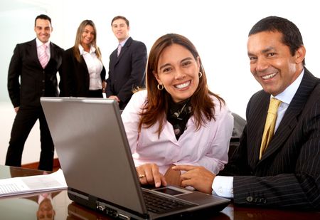 business office team with partners on a laptop in the foreground