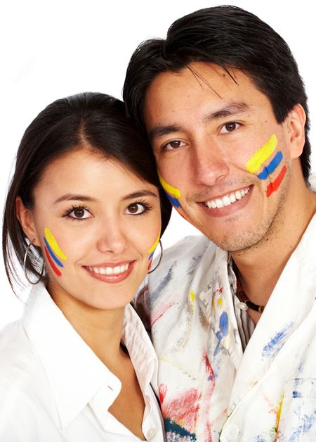 couple of artists with the primary colours painted on their faces - isolated over a white background
