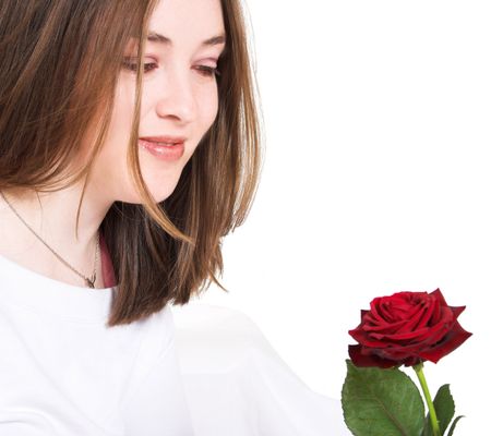 girl looking at her rose