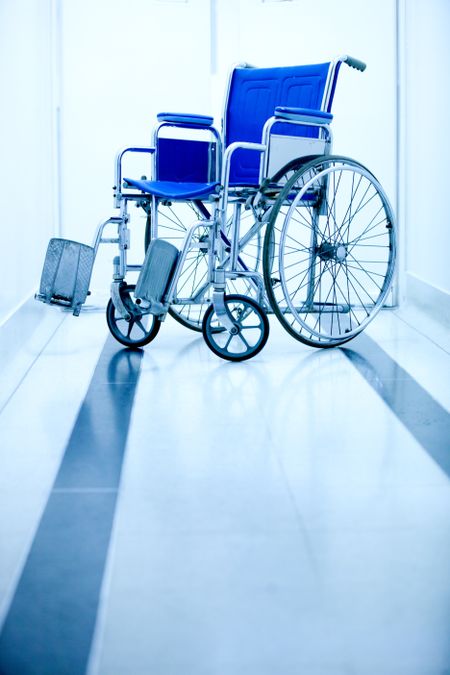 Blue wheelchair at the entrance of a hospital
