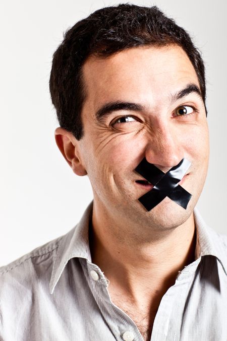 Man struggling to keep quiet with a tape in his mouth