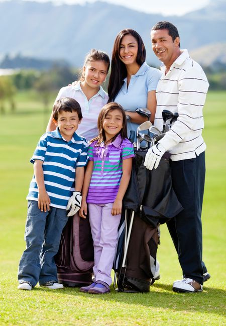 Family of golf players at the course looking happy