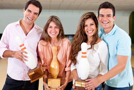Group of friends winning a bowling tournament