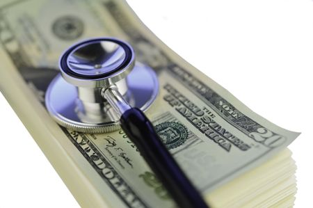 Examination of financial condition: Stethoscope on pile of U.S. twenty-dollar bills isolated on white background
