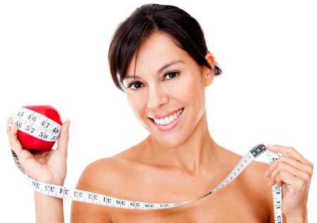 Healthy eating woman holding an apple and a tape measure - isolated