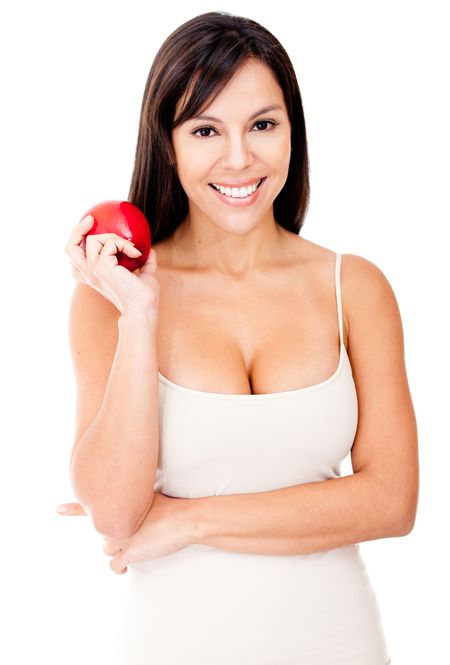 Woman on a diet holding a red apple - isolated over a white background