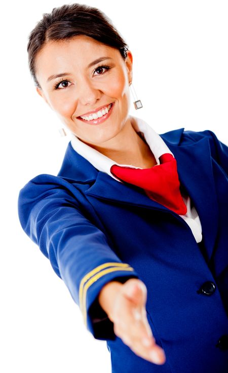 Welcoming air hostess with hand extended Ã?Â¢?? isolated over a white background